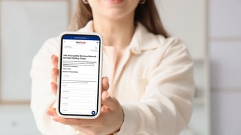 person holding phone registering as a bidder on govdeals